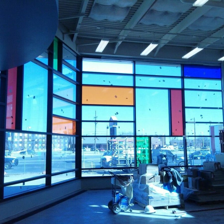 Colorful commercial storefront glass panel installation by Kent Glass in Colorado Springs