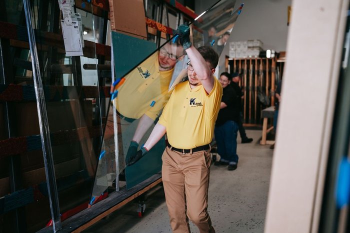 Kent Glass glazier handling a tempered glass panel