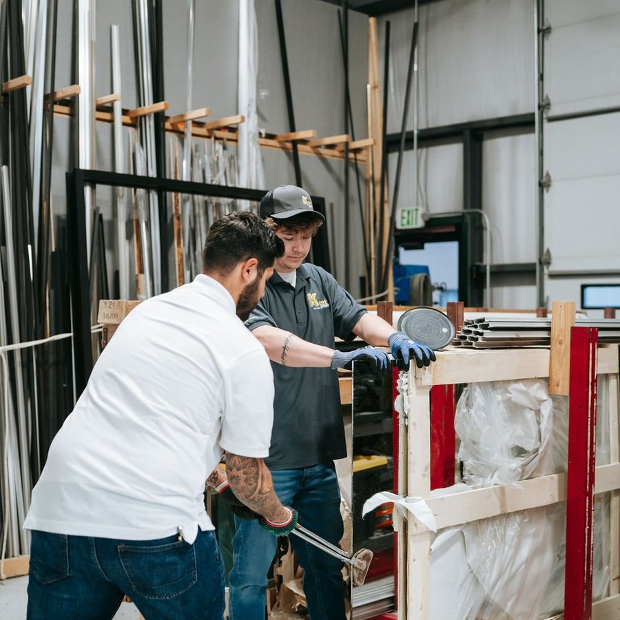 Kent Glass team moving glass through the Colorado Springs fabrication shop